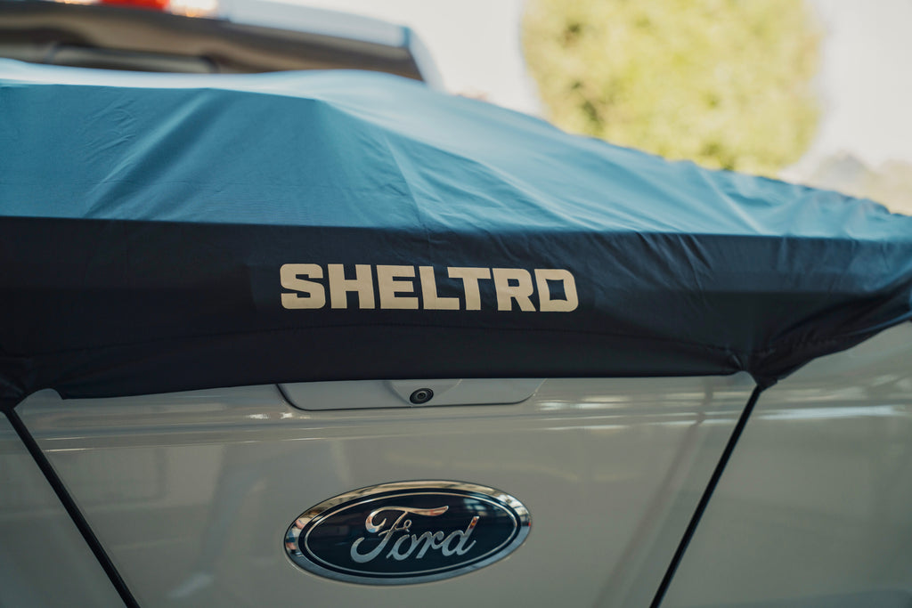 Sheltrd flexible truck bed cover across the tailgate of a Ford F-150